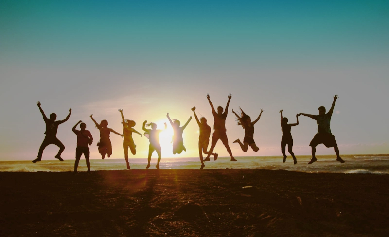 Healthy people jumping joyfully.
